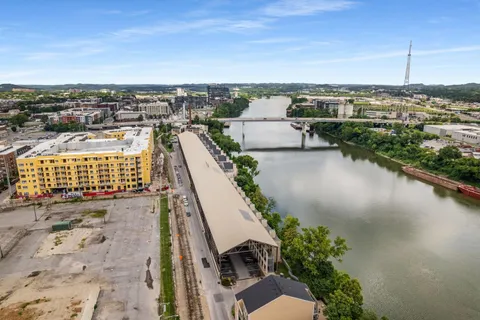 a view of a lake with a city skyline in the background