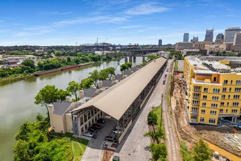 a view of a large building with swimming pool in front of it