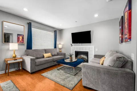 a living room with furniture and a table