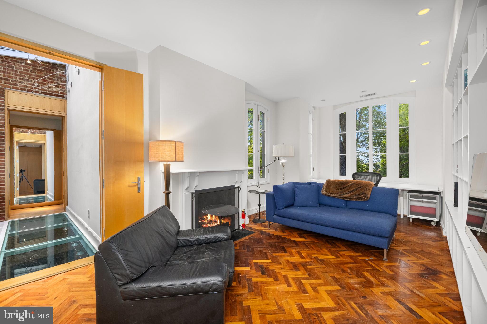2813 Q Street Northwest Washington, DC 20007 - Photo 14 of 22 a living room with furniture and a fireplace