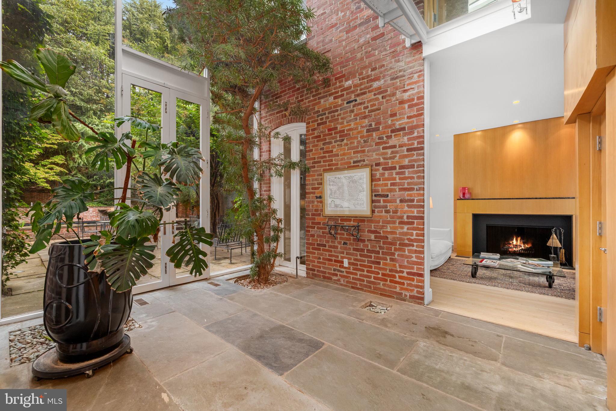 2813 Q Street Northwest Washington, DC 20007 - Photo 2 of 22 a view of a entryway door with brick wall