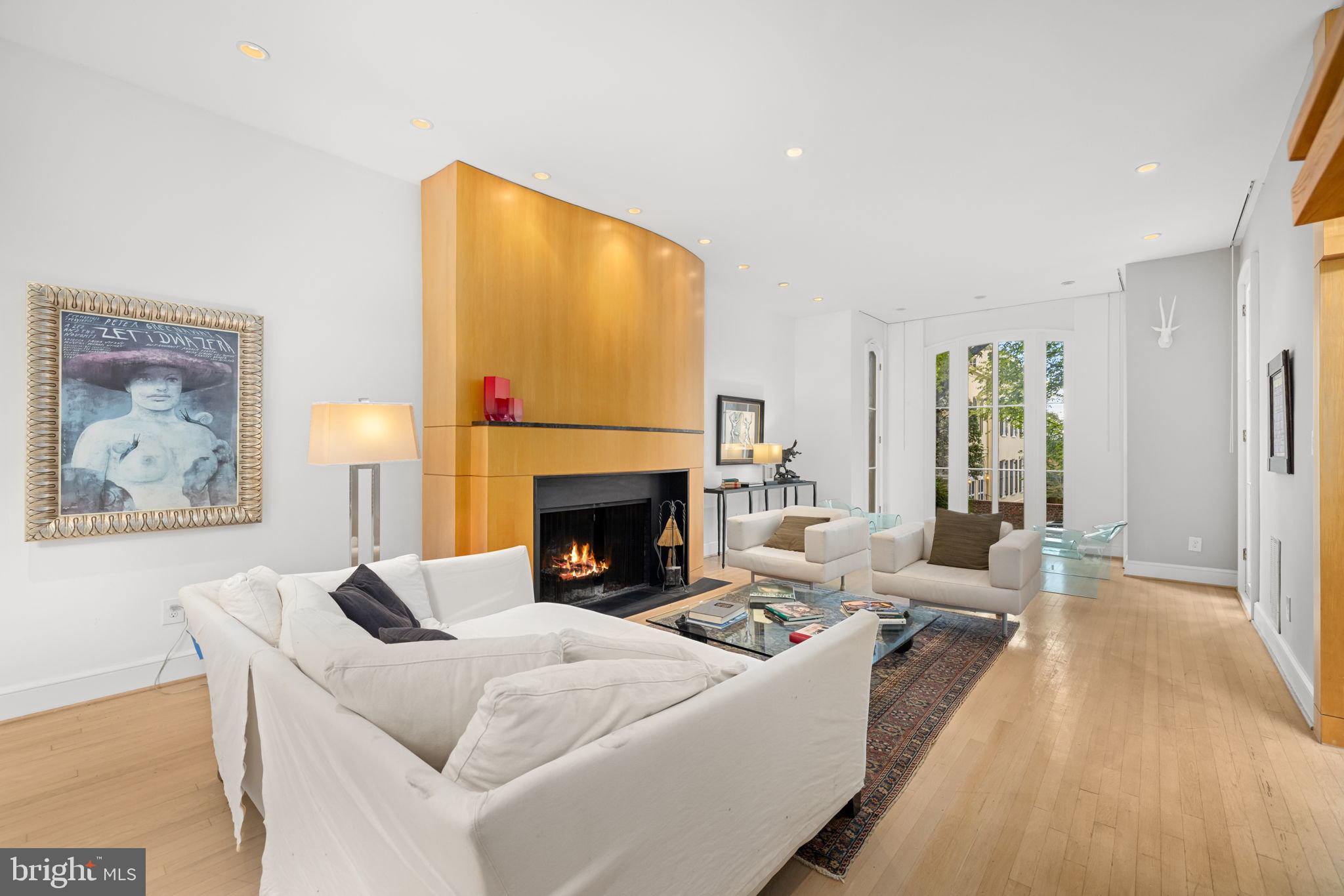 2813 Q Street Northwest Washington, DC 20007 - Photo 3 of 22 a living room with furniture and a fireplace