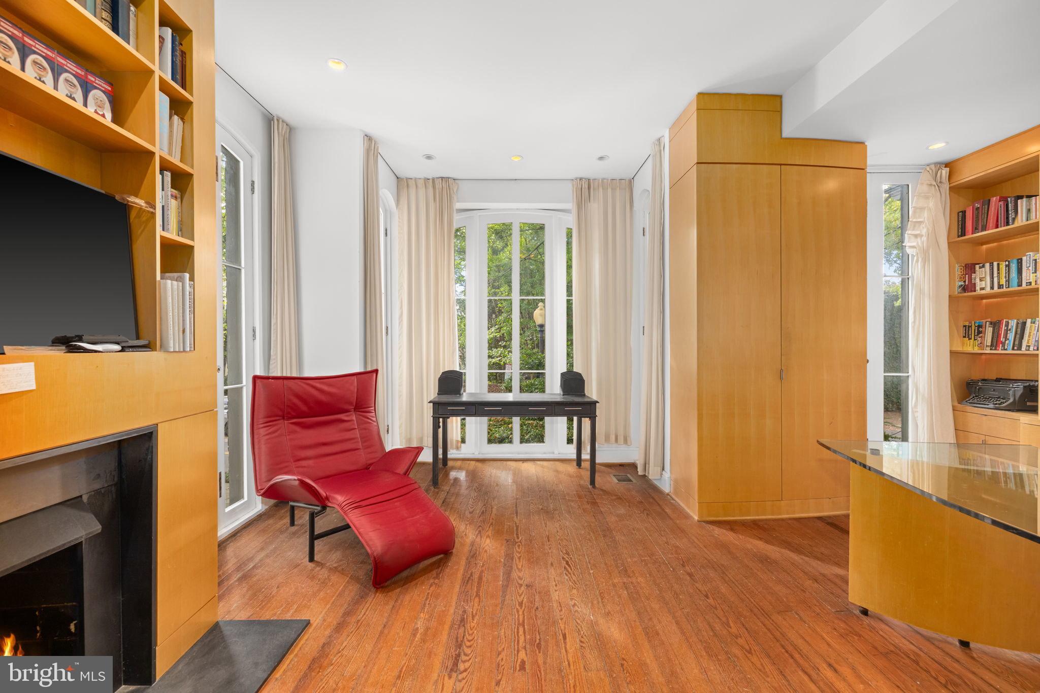 2813 Q Street Northwest Washington, DC 20007 - Photo 4 of 22 a living room with furniture and a flat screen tv