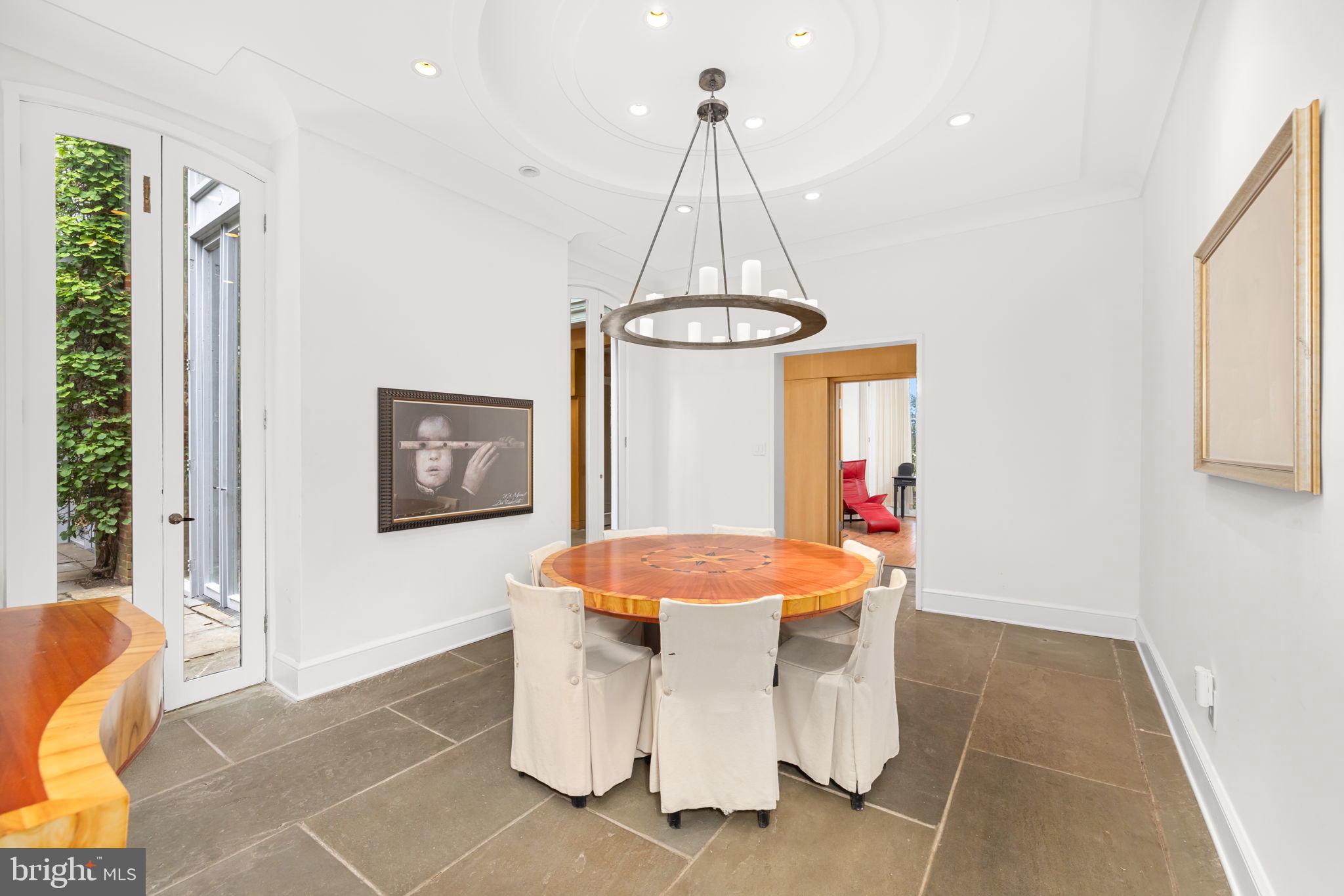 2813 Q Street Northwest Washington, DC 20007 - Photo 5 of 22 a dining room with a table and chairs