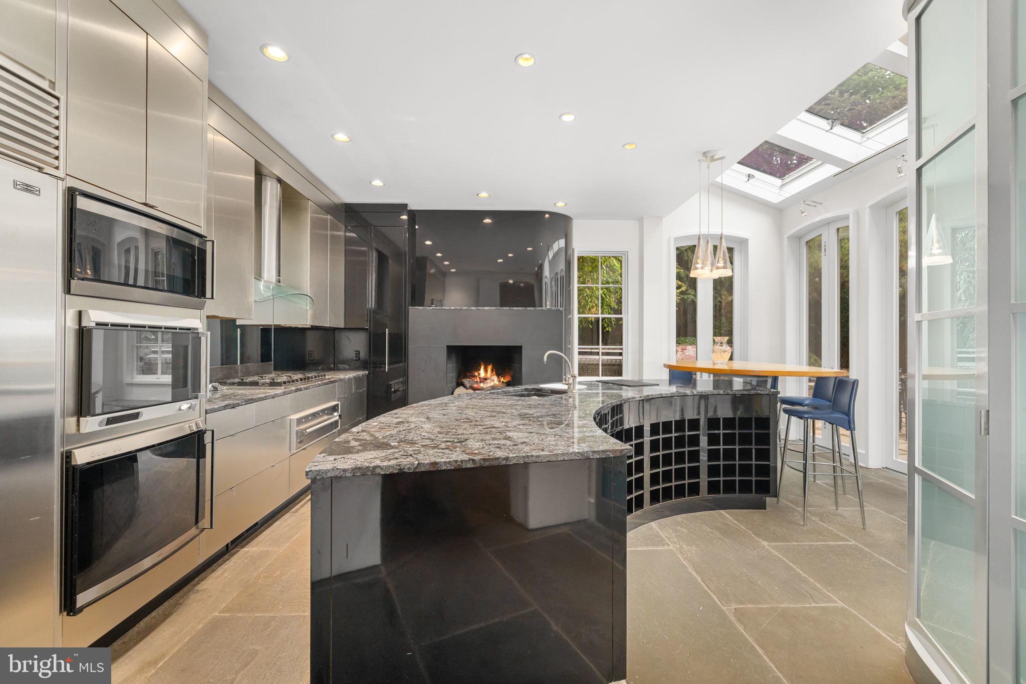 2813 Q Street Northwest Washington, DC 20007 - Photo 6 of 22 a kitchen with stainless steel appliances granite countertop a stove and a sink
