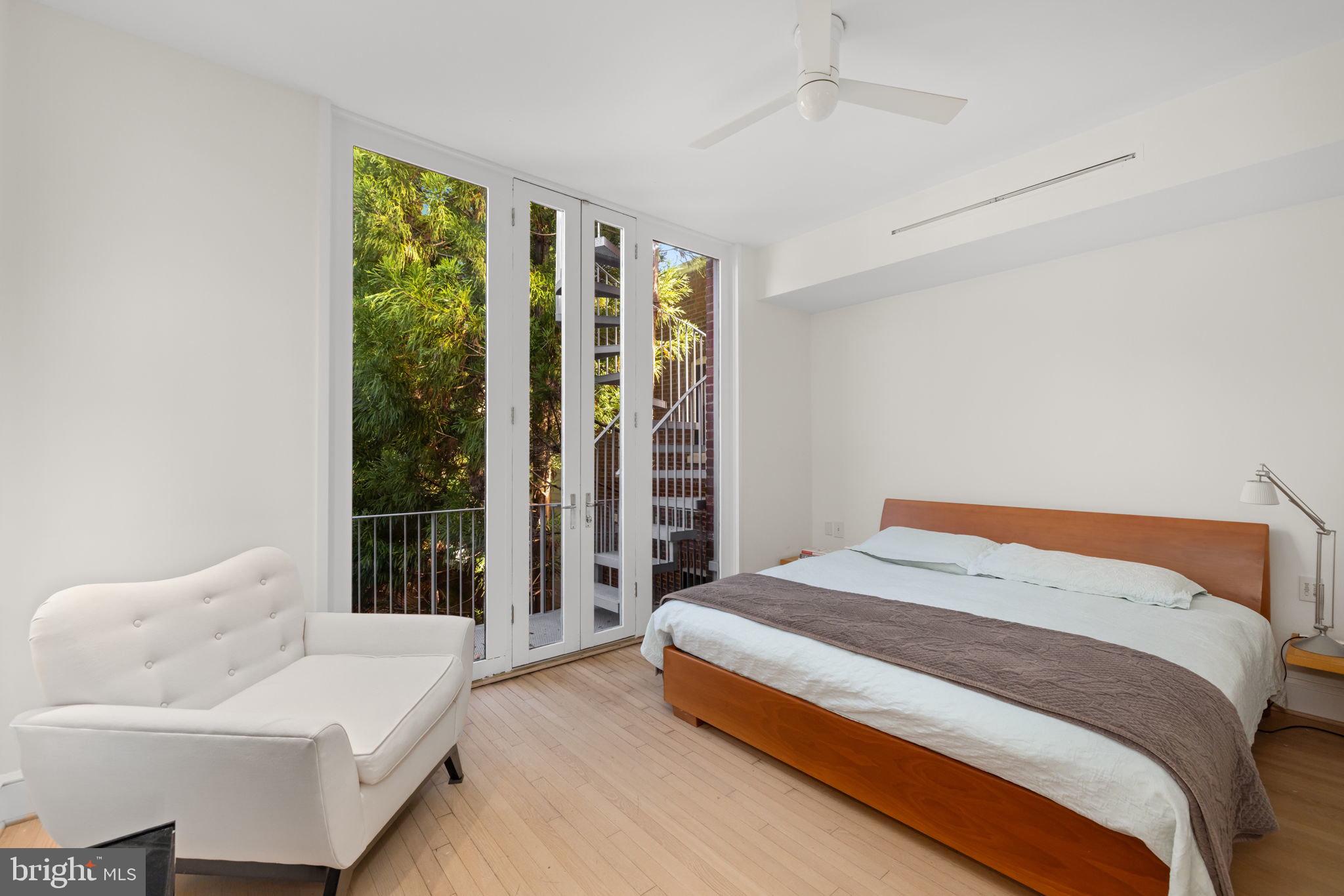2813 Q Street Northwest Washington, DC 20007 - Photo 7 of 22 a bedroom with a bed and wooden floor