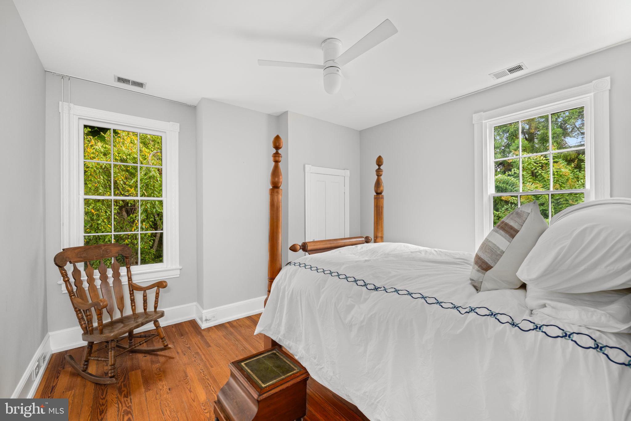 2813 Q Street Northwest Washington, DC 20007 - Photo 10 of 22 a bedroom with a bed and a chair
