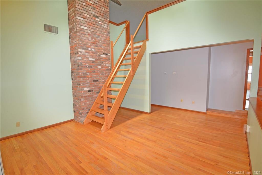 405 Maple Avenue Cheshire, CT 06410 - Photo 15 of 37 a view of an empty room with stairs