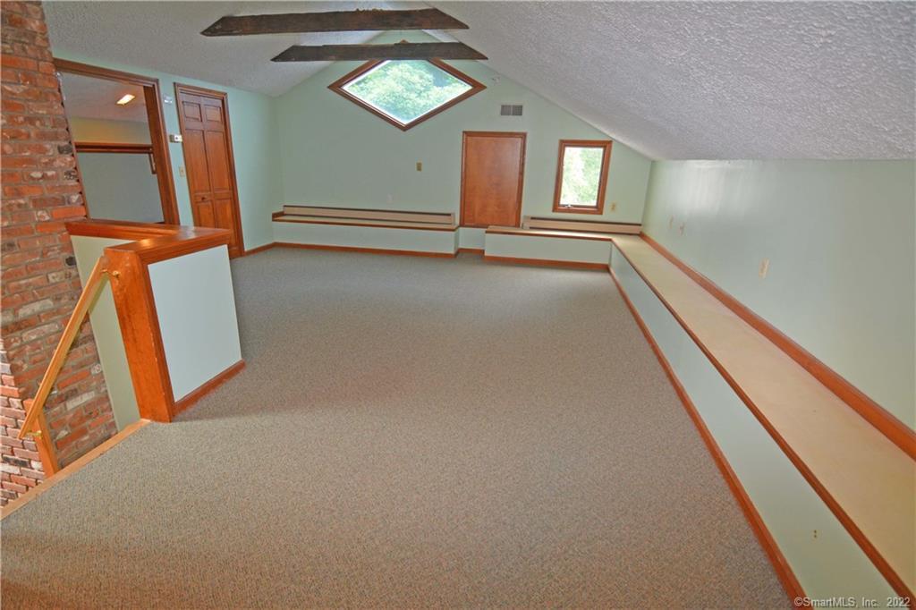 405 Maple Avenue Cheshire, CT 06410 - Photo 20 of 37 view of room with window and stairs