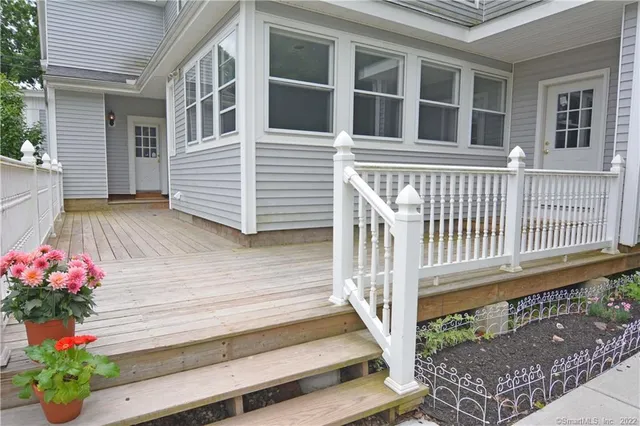 a view of a house with a house and wooden floor