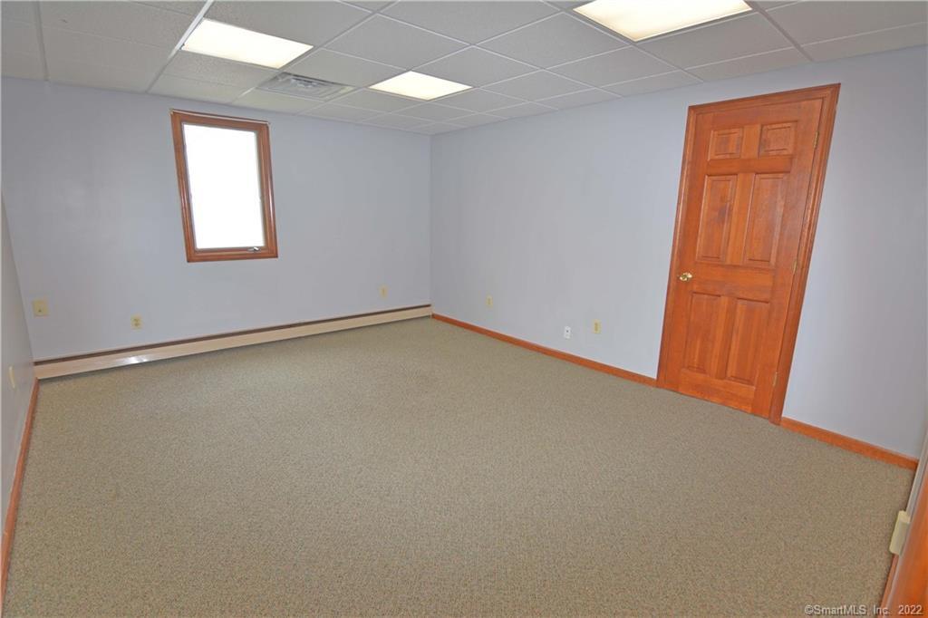 405 Maple Avenue Cheshire, CT 06410 - Photo 24 of 37 an empty room with a window