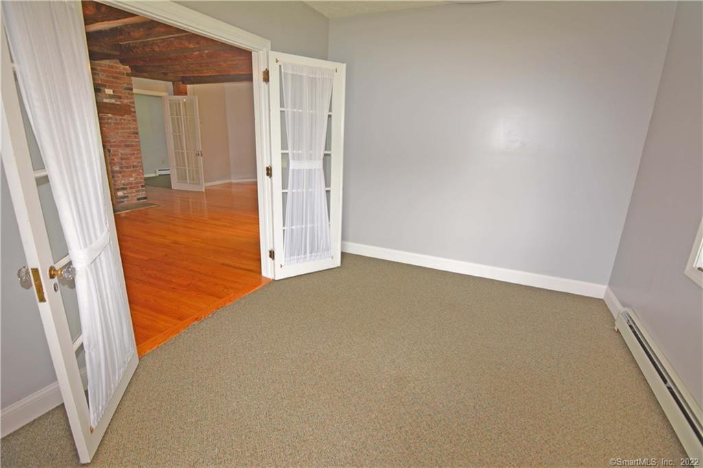 405 Maple Avenue Cheshire, CT 06410 - Photo 34 of 37 an empty room with windows