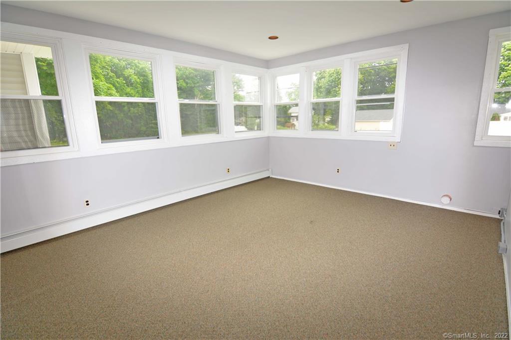 405 Maple Avenue Cheshire, CT 06410 - Photo 35 of 37 an empty room with a window