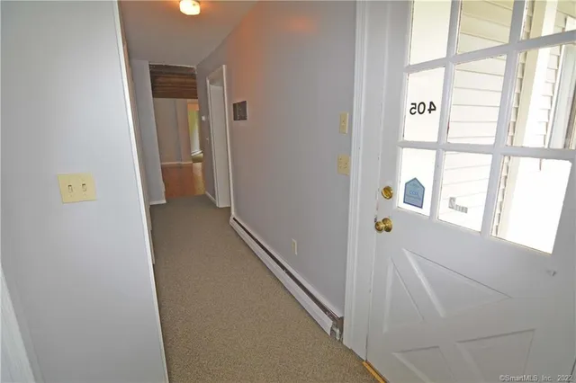 a view of hallway with windows