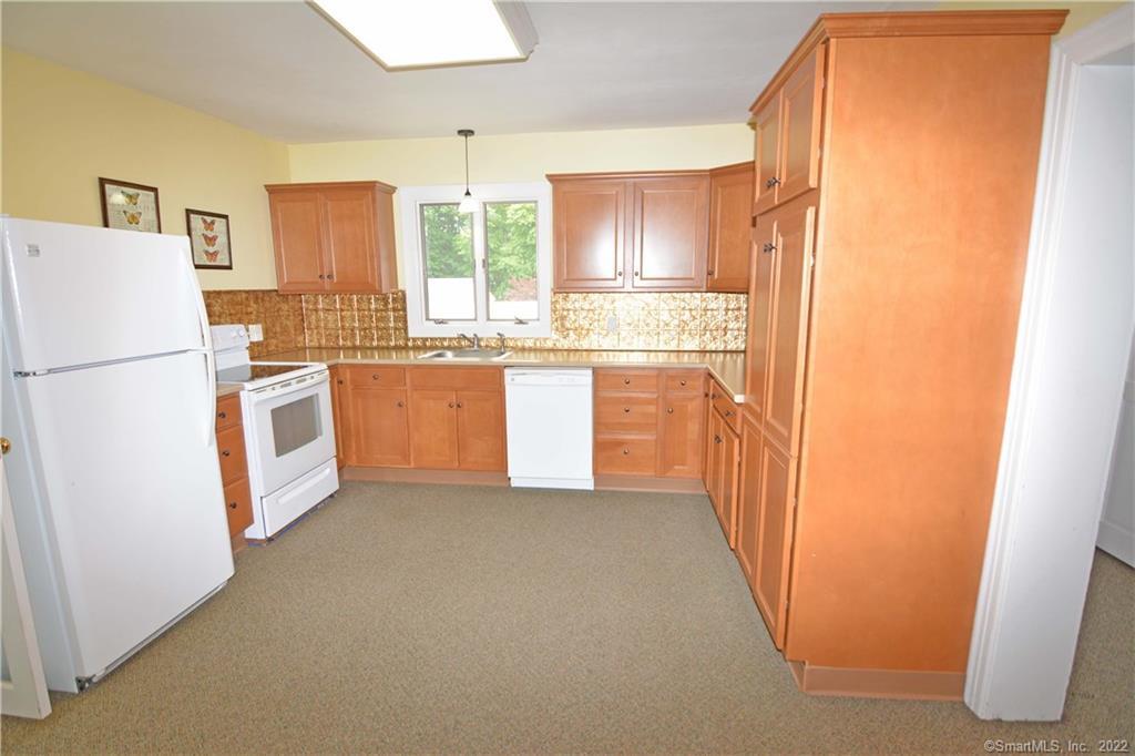 405 Maple Avenue Cheshire, CT 06410 - Photo 6 of 37 a kitchen with stainless steel appliances a refrigerator and a stove
