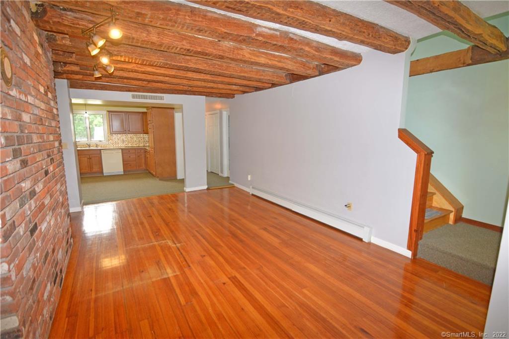 405 Maple Avenue Cheshire, CT 06410 - Photo 8 of 37 a view of a room with wooden floor