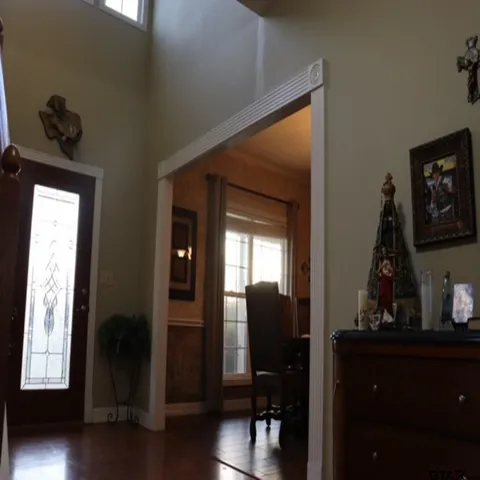 a view of front door with wooden floor