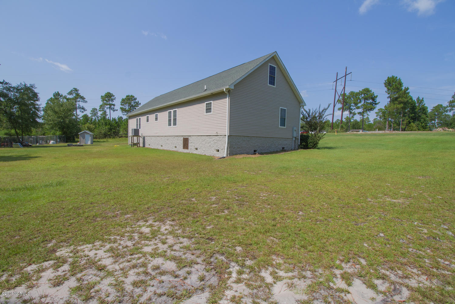 724 Ridgecrest Lane Rocky Point, NC 28457 - Photo 21 of 21 724 Ridgecrest Ln-large-021-16-Rear Exte