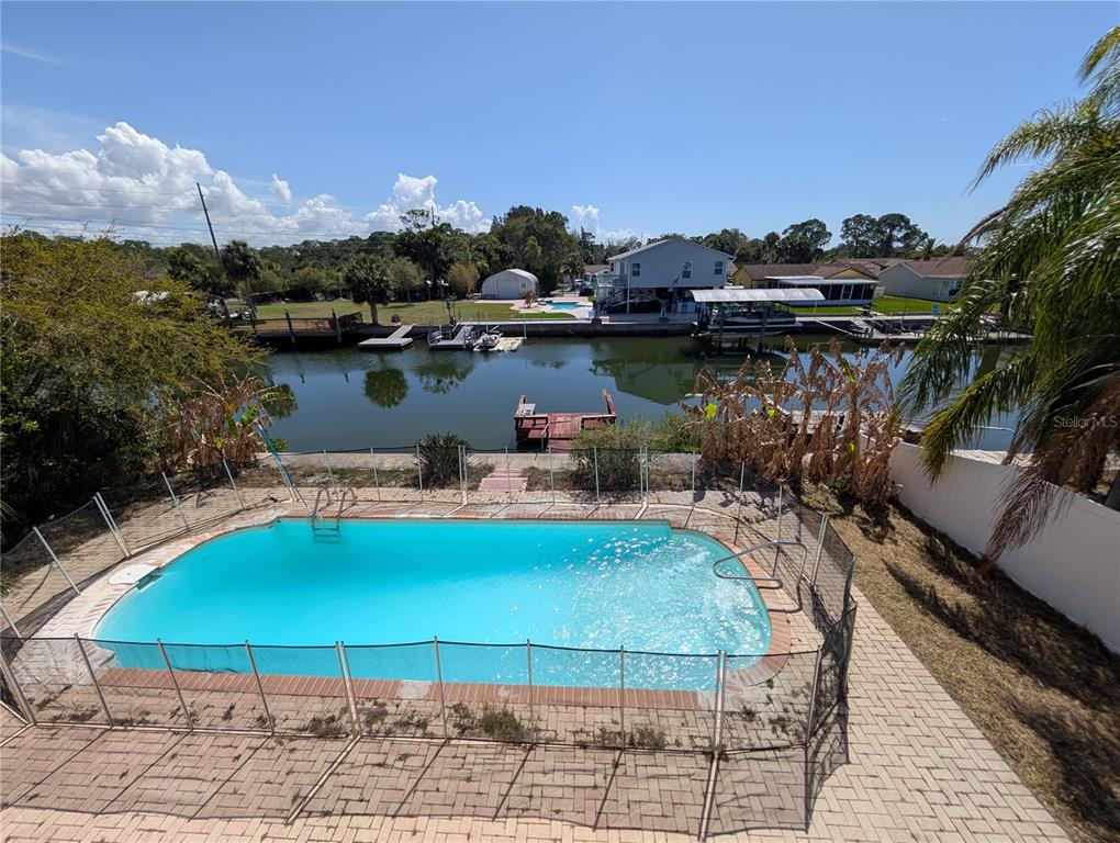 7436 Islander Lane Hudson, FL 34667 - Photo 23 of 27 a view of a lake with outdoor space