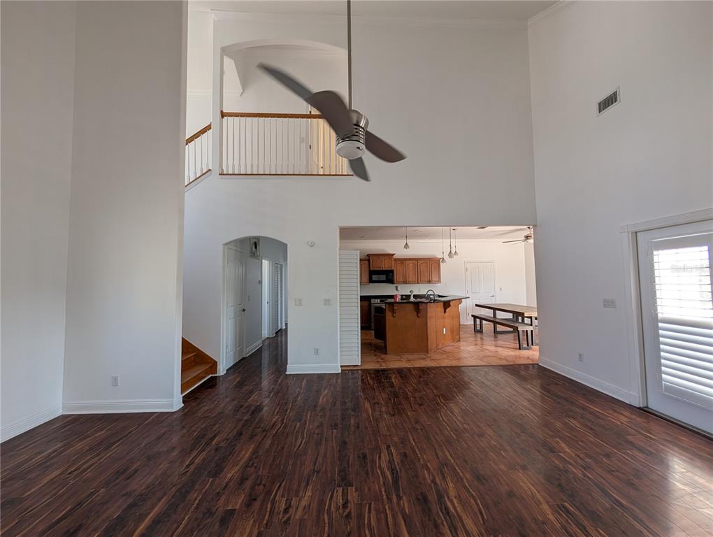 7436 Islander Lane Hudson, FL 34667 - Photo 3 of 27 a view of a room with wooden floor fire place
