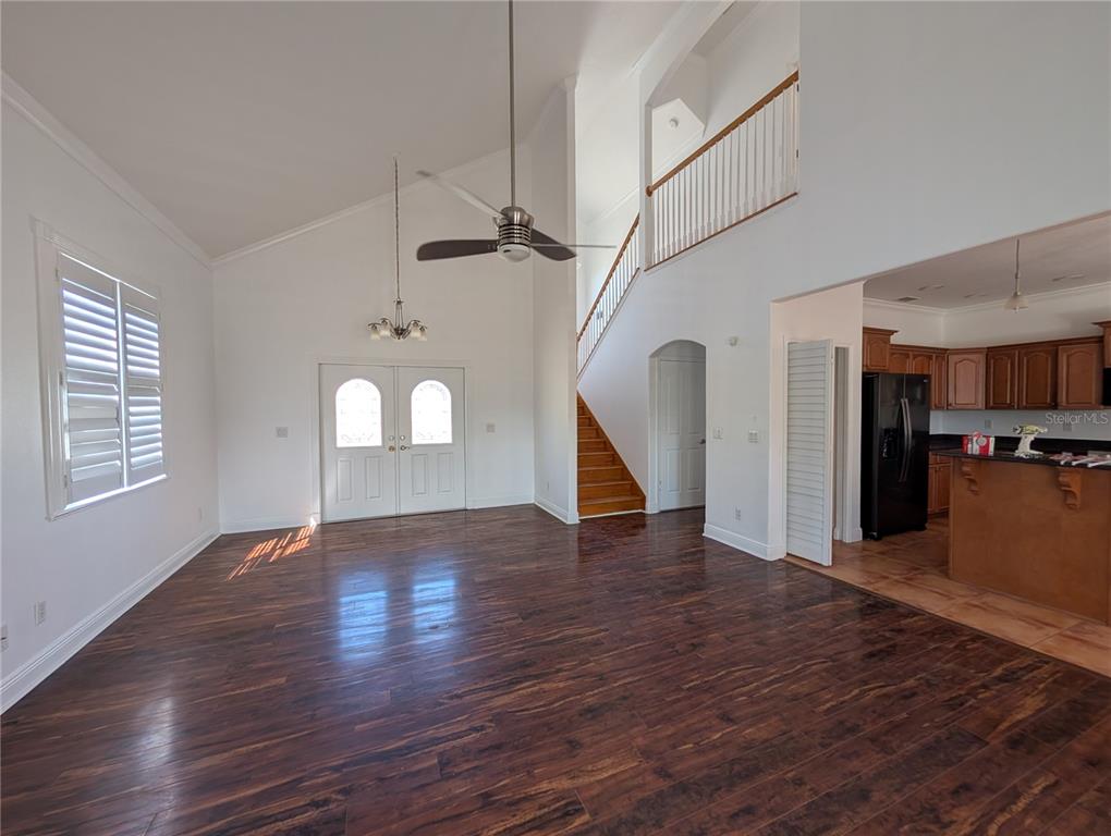 7436 Islander Lane Hudson, FL 34667 - Photo 4 of 27 a view of empty room with wooden floor and window