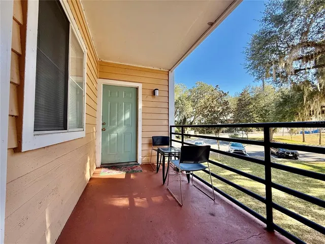 a view of a two chairs in the porch