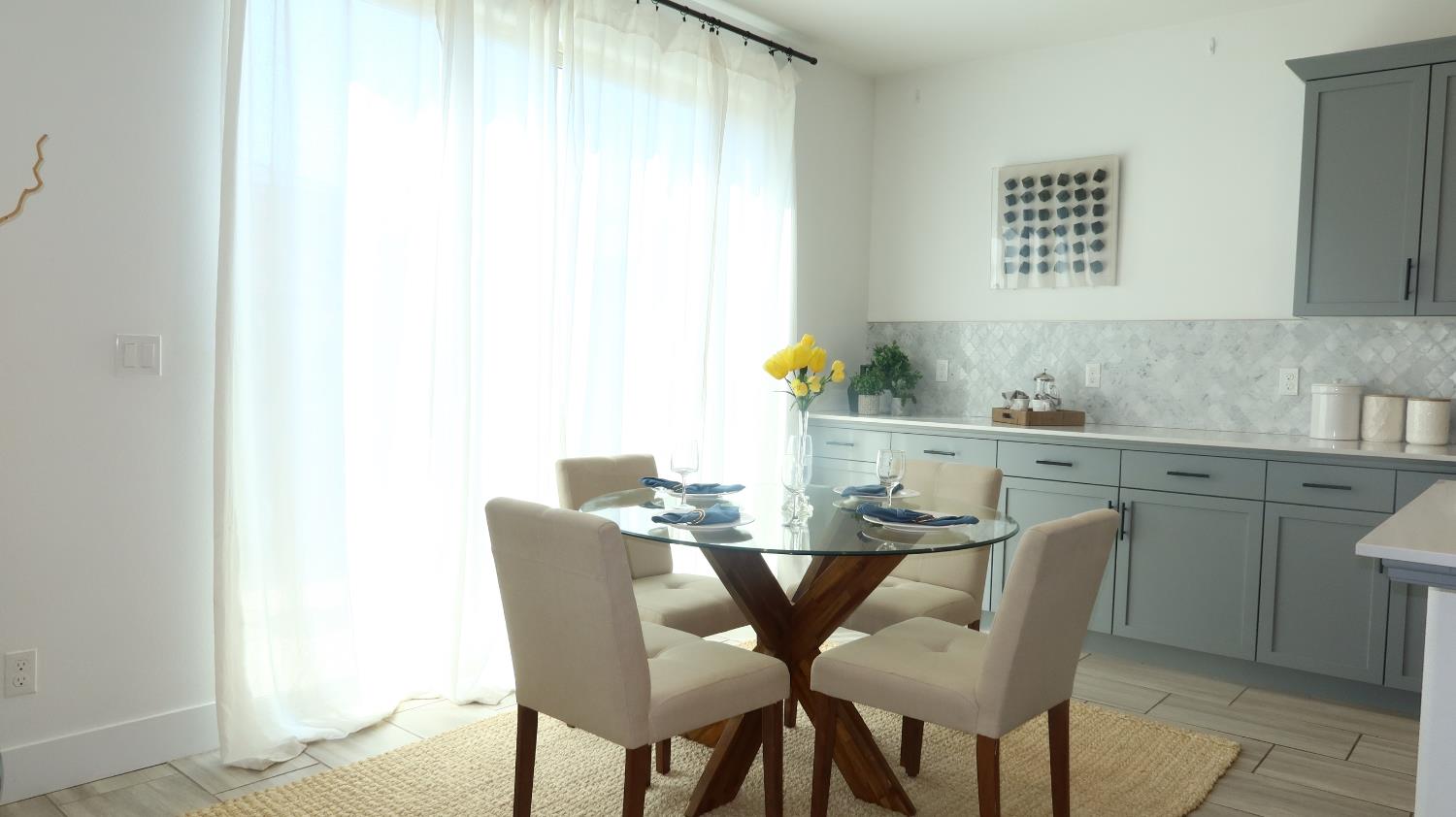 4254 Oak Knoll Road Madera, CA 93636 - Photo 14 of 74 a dining room with a table and chairs
