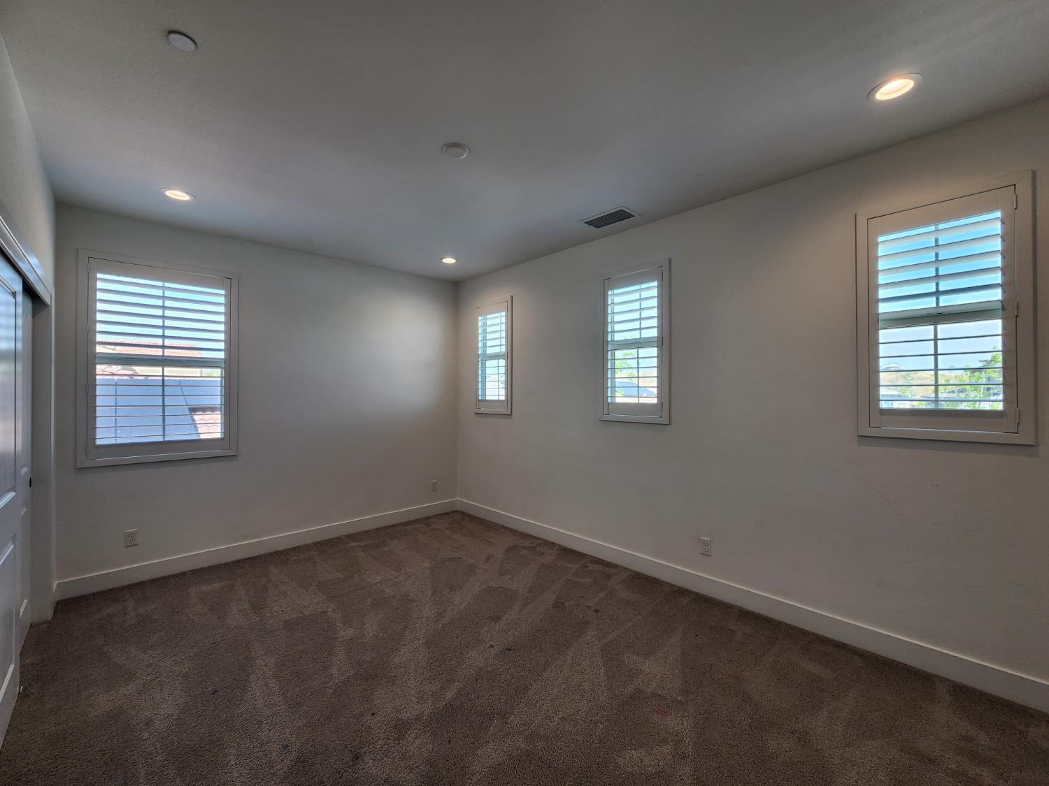 4254 Oak Knoll Road Madera, CA 93636 - Photo 36 of 74 an empty room with windows
