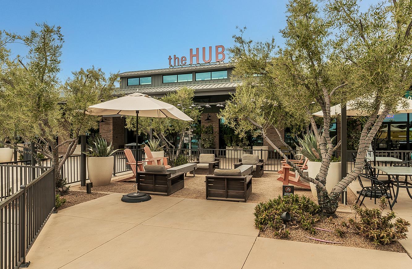 4254 Oak Knoll Road Madera, CA 93636 - Photo 51 of 74 a view of a patio with couches table and chairs under an umbrella with wooden fence