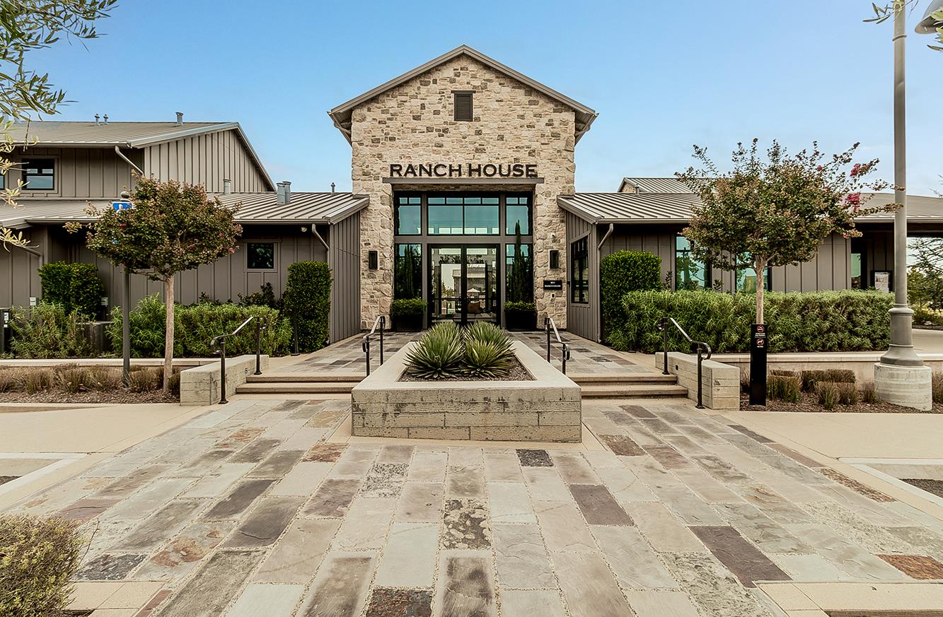 4254 Oak Knoll Road Madera, CA 93636 - Photo 66 of 74 a view of a building with potted plants and palm trees