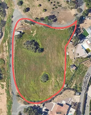 an aerial view of a highlighted house