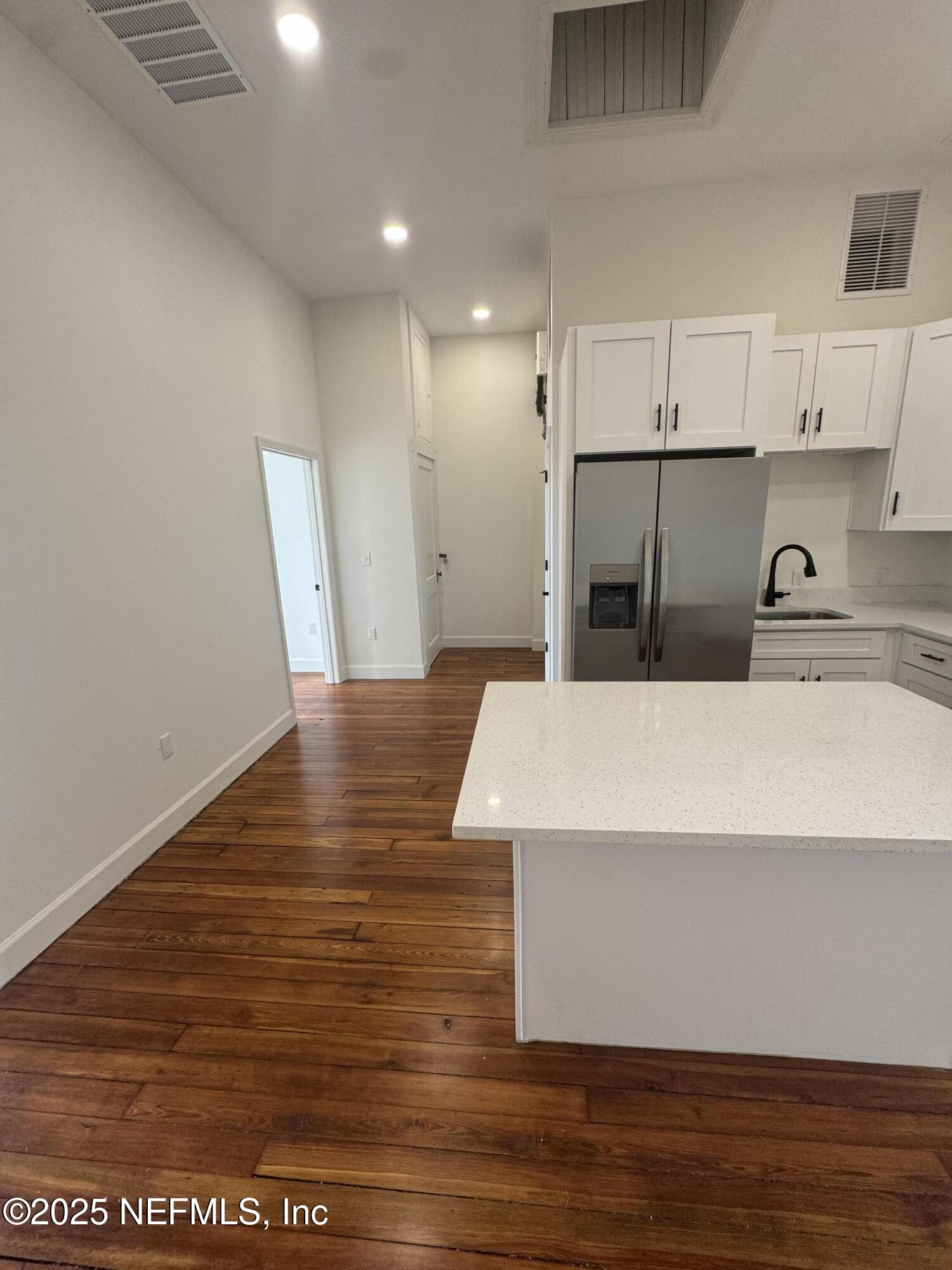 115 East Call Street Starke, FL 32091 - Photo 3 of 11 a view of kitchen with stainless steel appliances granite countertop sink