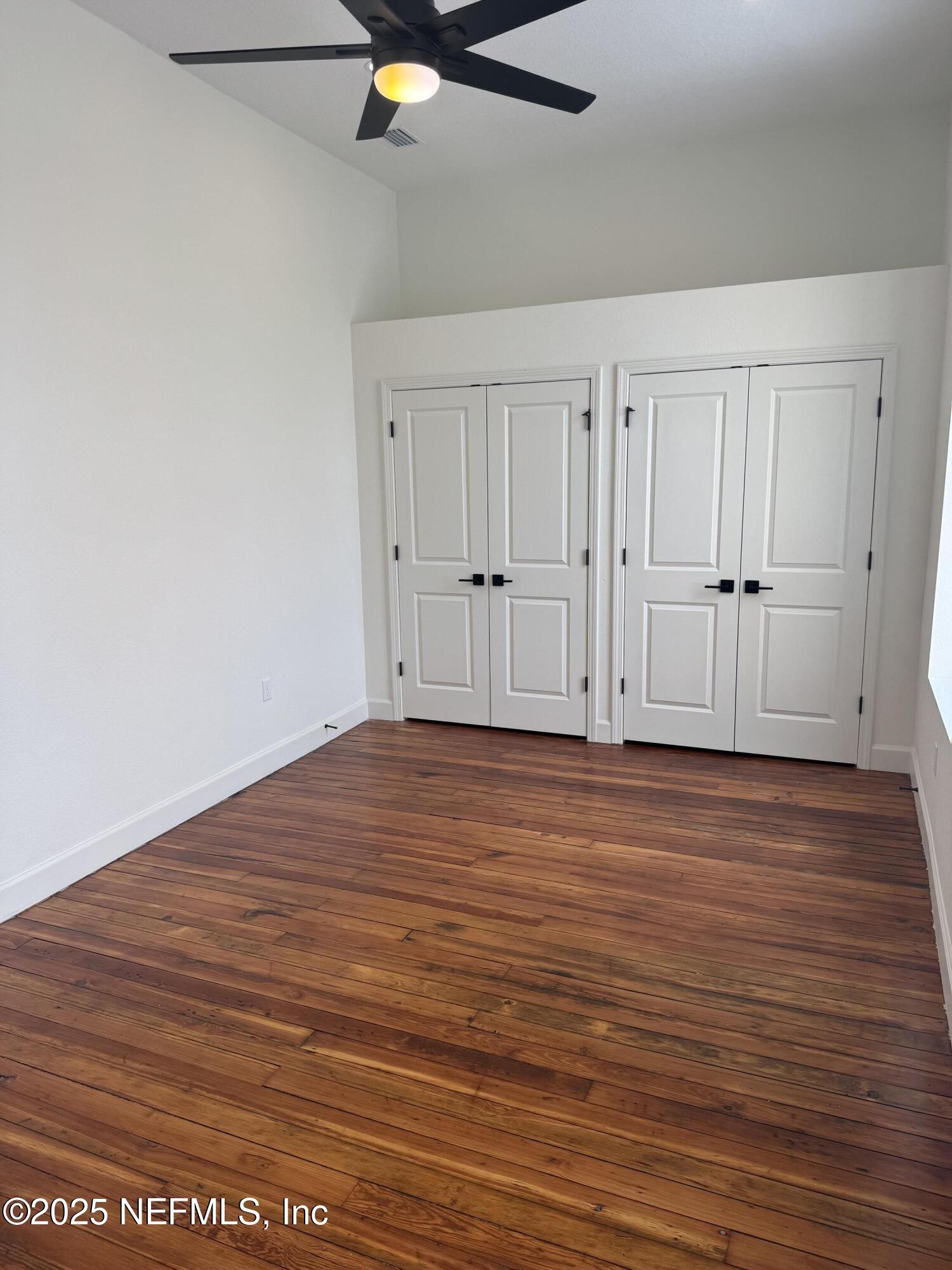 115 East Call Street Starke, FL 32091 - Photo 7 of 11 a view of a livingroom with wooden floor
