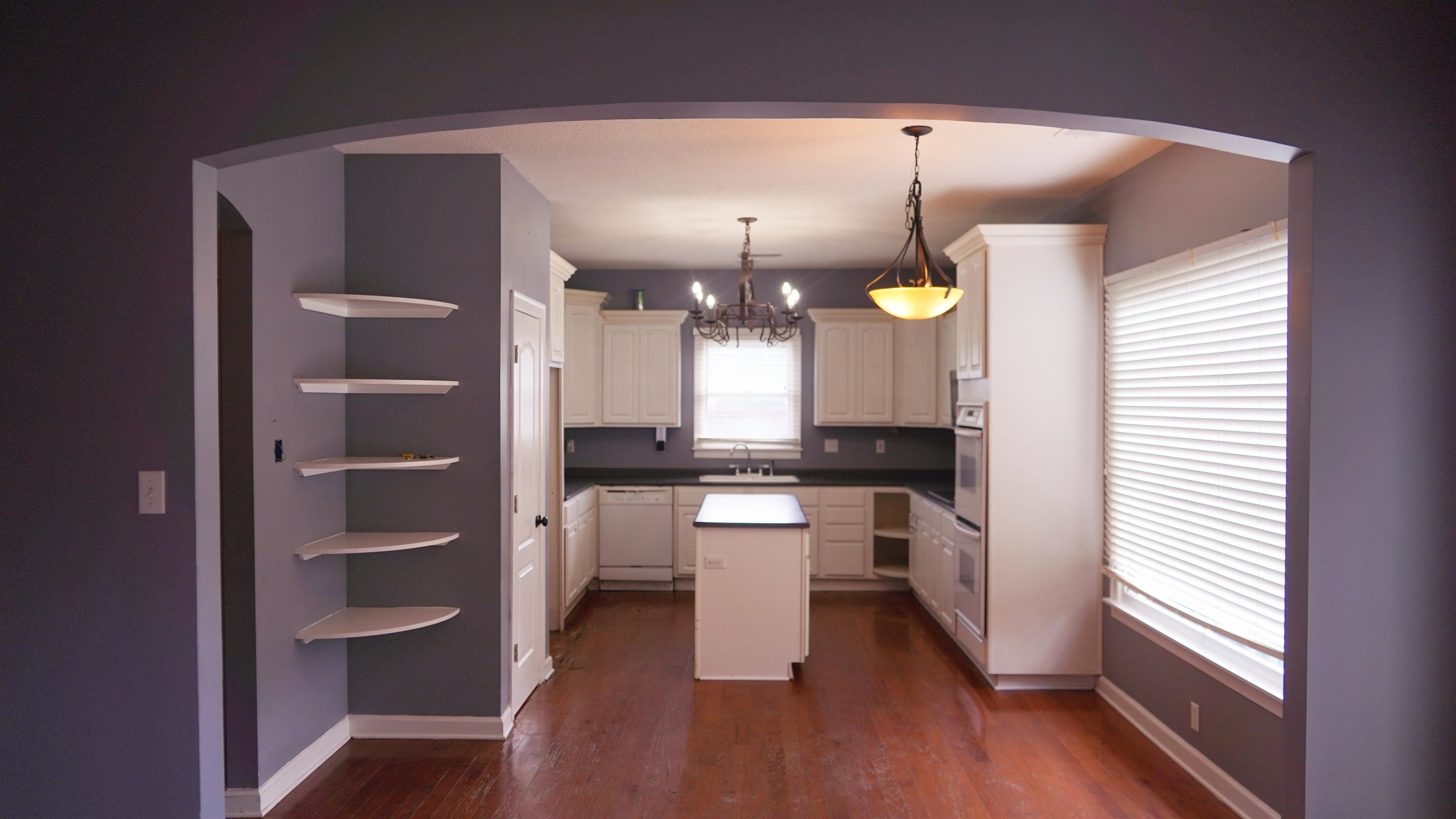 3717 Meade Lake Road Millington, TN 38053 - Photo 4 of 16 Kitchen featuring a center island, open shelves, hanging lights, white cabinetry, and white appliances