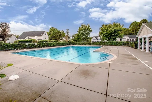 a view of swimming pool from a lounge chair