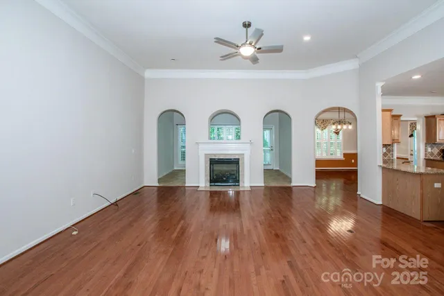 a view of livingroom with fireplace wooden floor and window