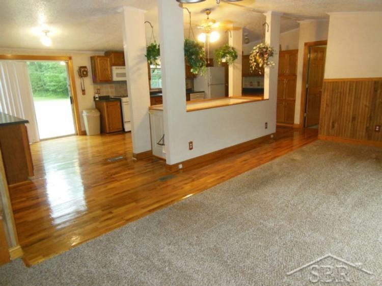 6891 North Bay Midland County Line Road Rhodes, MI 48652 - Photo 7 of 29 Living room open to kitchen