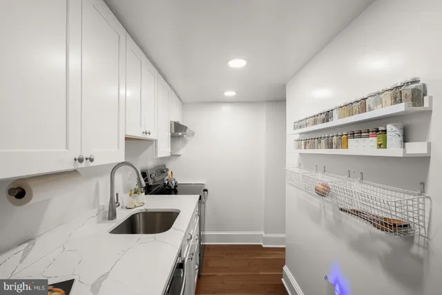 a kitchen with a sink and cabinets