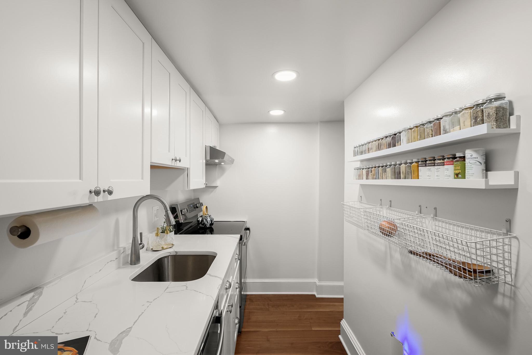 408 Seward Square Southeast, Unit 1 Washington, DC 20003 - Photo 12 of 21 a kitchen with a sink and cabinets