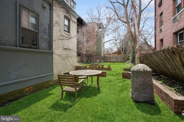 a garden view with a seating space