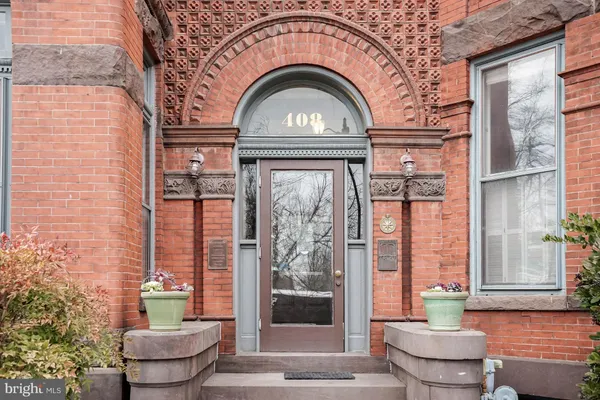 a view of a wooden door of a house