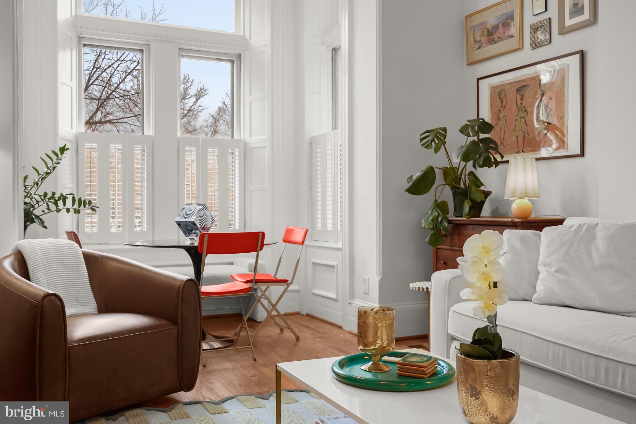 408 Seward Square Southeast, Unit 1 Washington, DC 20003 - Photo 4 of 21 a living room with furniture and a potted plant
