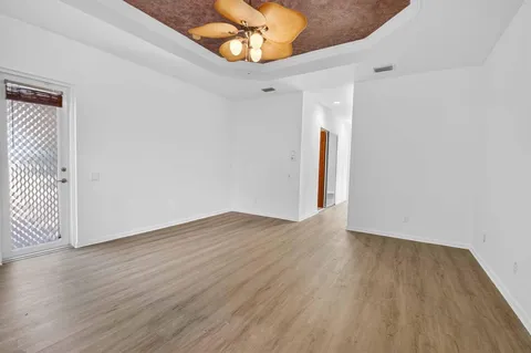 a spacious bathroom with double sink and a mirror