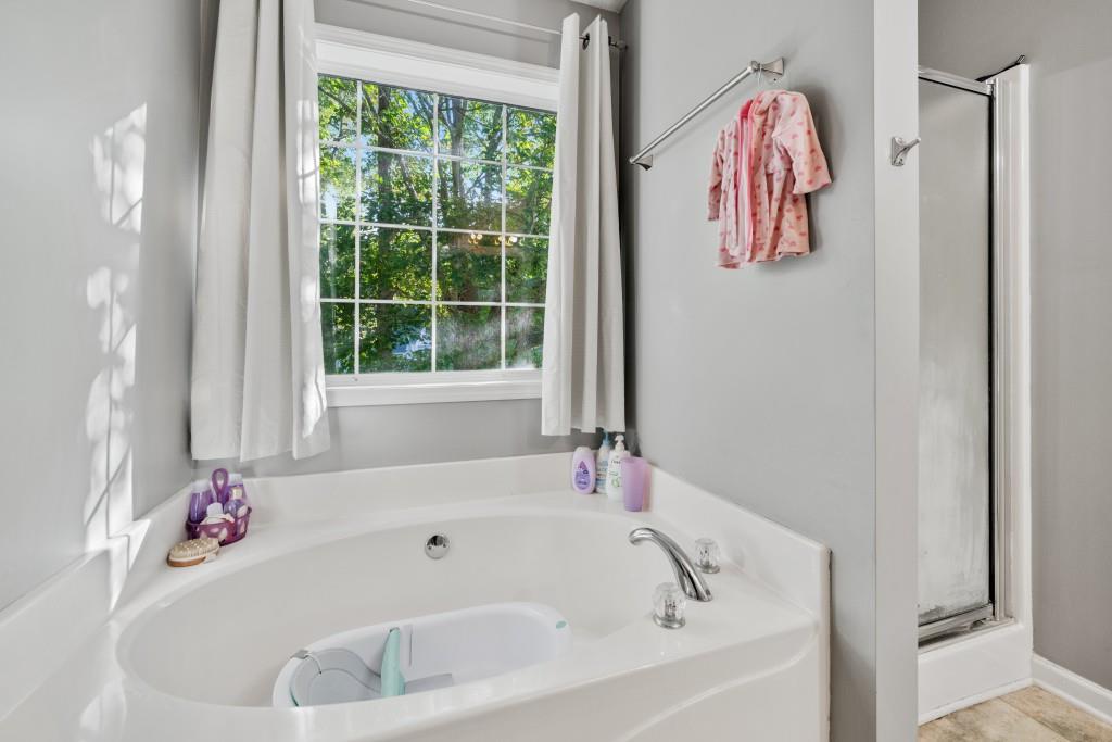 160 Azalea Drive Winder, GA 30680 - Photo 15 of 32 a white bath tub sitting next to a window