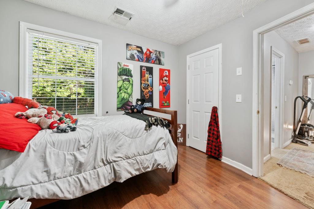 160 Azalea Drive Winder, GA 30680 - Photo 16 of 32 a bed sitting in a bedroom next to a window