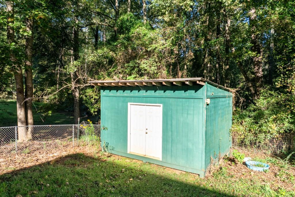 160 Azalea Drive Winder, GA 30680 - Photo 26 of 32 a front view of a house with a yard