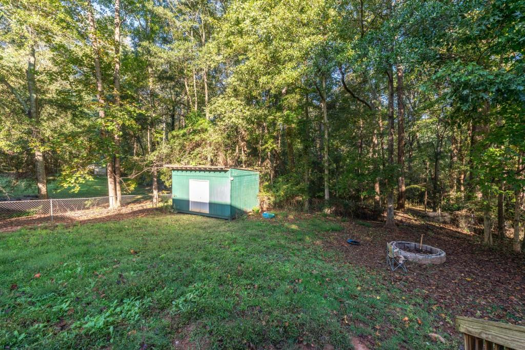 160 Azalea Drive Winder, GA 30680 - Photo 27 of 32 a view of backyard with trees