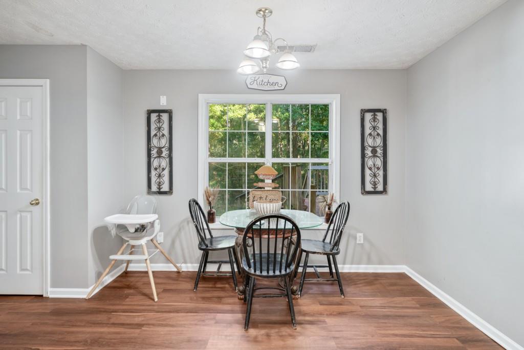 160 Azalea Drive Winder, GA 30680 - Photo 10 of 32 a view of a dining room with furniture window and wooden floor