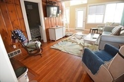 23 Everson Road, Unit 23 Marshfield, MA 02050 - Photo 4 of 6 a living room with furniture and a fireplace