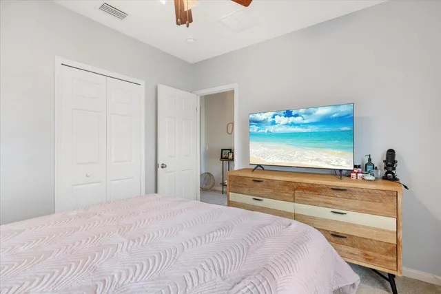 a bedroom with furniture a baby crib and a dresser